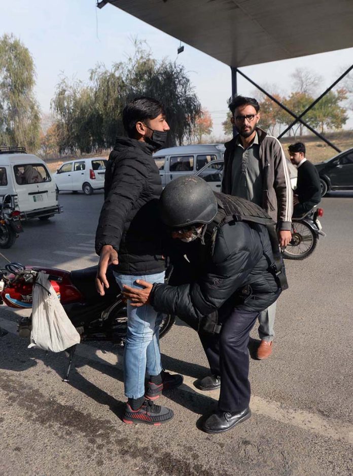 Capital police checking motorcyclist during snap checking at Expressway