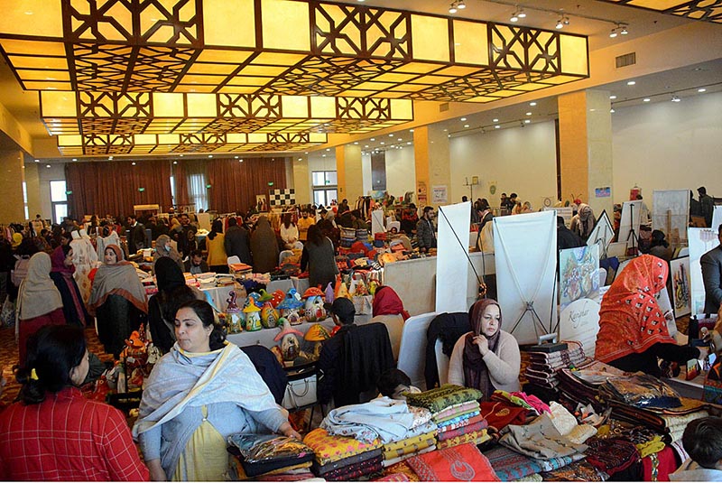 Artisans displaying their products on their stalls during the "BEHBUD Art & Craft Bazaar" at Pak-China Friendship Center