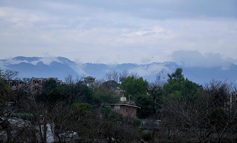An attractive view of clouds hovering over Margalla Hills during rainfall