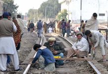 Labourers are busy in repairing railway tracks at Faqirabad area during maintenance work