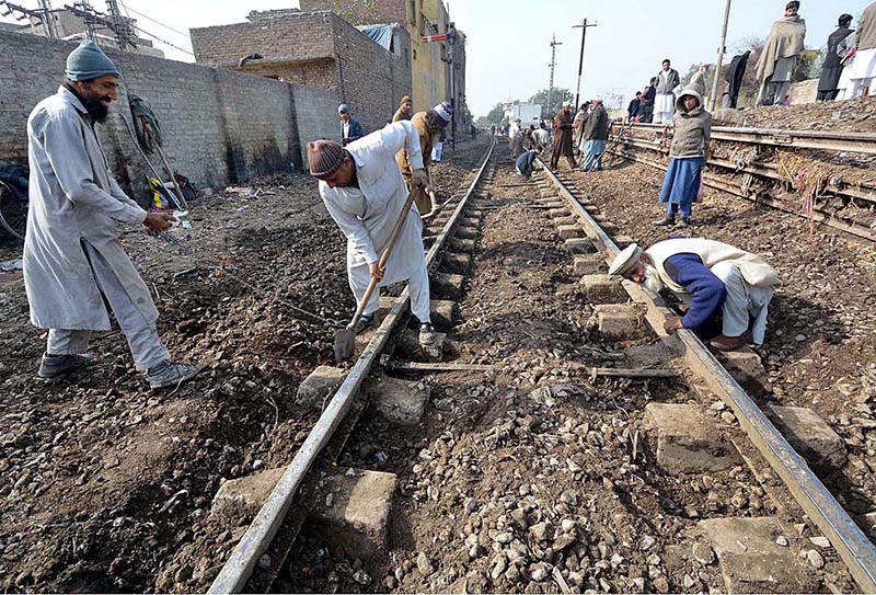 Labourers are busy in repairing railway tracks at Faqirabad area during maintenance work