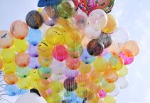 A street hawker displaying colorful balloons to sell at G-7 area