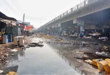 A view of garbage and water accumulated at Novelty Bridge near Fish Market creating environment problems and needs the attention of concerned authorities.