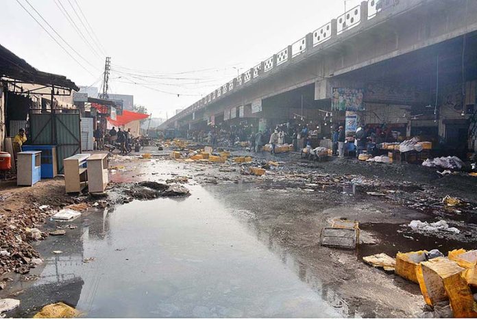 A view of garbage and water accumulated at Novelty Bridge near Fish Market creating environment problems and needs the attention of concerned authorities.