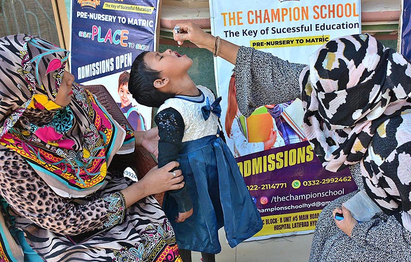 A lady health worker is administering Polio vaccine to a child during Polio free Pakistan Campaign fight to end the crippling poliovirus at Latifabad area of the city