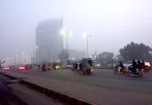 Thick fog engulfs the Ferozepur Road during morning time
