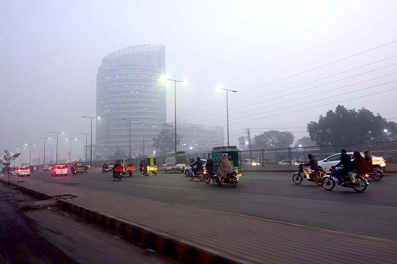 Thick fog engulfs the Ferozepur Road during morning time