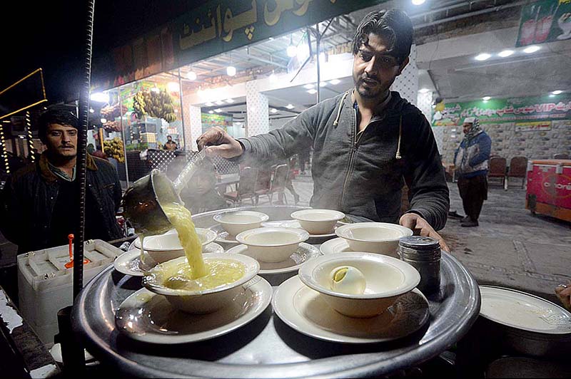 Vendor selling and displaying chicken corn soup to attract the customers during cold weather
