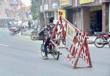A youngster carrying a barrier on a motorcycle in risky way may cause of any mishap