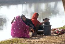 Gypsy ladies washing their clothes at a local canal
