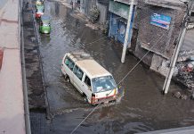 Vehicles passing through sewerage water accumulated at GTS underpass and needs attention of the concerned authorities