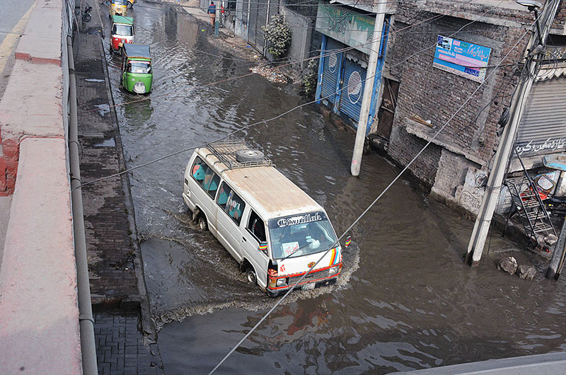 Vehicles passing through sewerage water accumulated at GTS underpass and needs attention of the concerned authorities