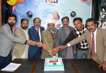 Federal Parliamentary Secretary for Petroleum Hamid Hameed and Vice President PMA Punjab Dr. Sikandar Hayat Waraich cutting cake to celebrate 2nd anniversary of PNN News at Madia Club