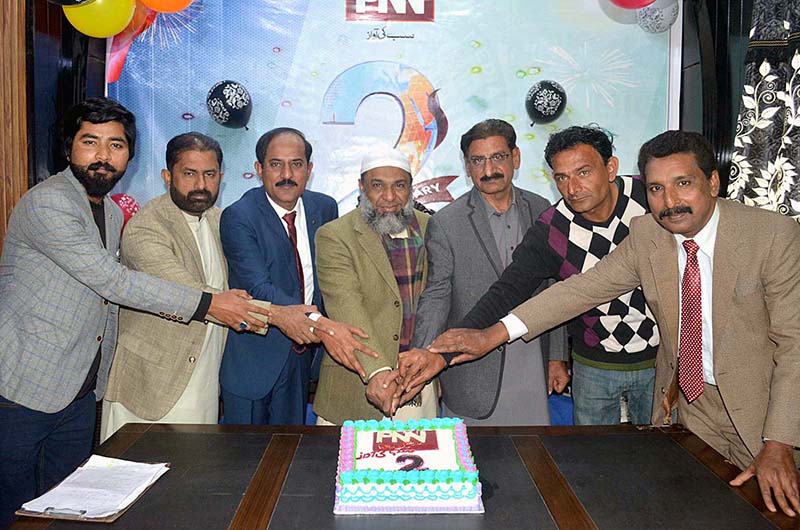 Federal Parliamentary Secretary for Petroleum Hamid Hameed and Vice President PMA Punjab Dr. Sikandar Hayat Waraich cutting cake to celebrate 2nd anniversary of PNN News at Madia Club