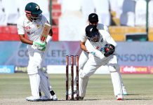 New Zealand's wicketkeeper Tom Latham catches the ball, missed by Pakistan's captain Babar Azam during the fifth and final day of the Second Cricket Test match between Pakistan and New Zealand at the National Stadium