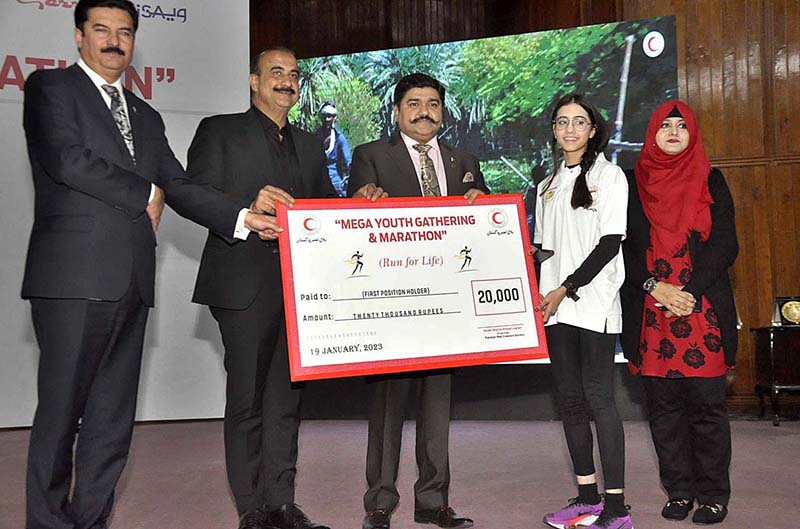 State Minister for Poverty Alleviation & Social Safety Pakistan, Faisal Karim Kundi , Chairman PRCS, Sardar Shahid Ahmed Laghari and Patron in chief of Pakistan Sweet Homes Zamurd Khan awarding cheque at "Mega Youth Gathering & Marathon" under the theme 'Run Far Life' at Jinnah Convention centre