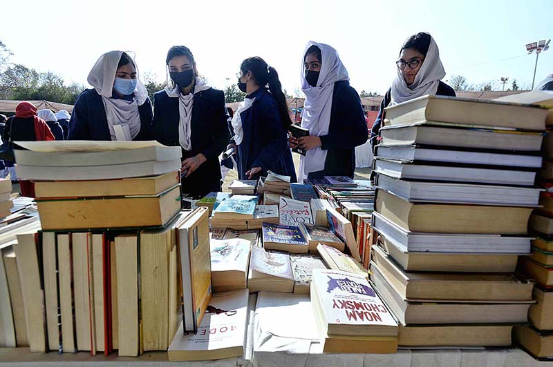 Students are taking keen interest in books at a stall during the 4 days Capital Book Fair-2023 at Arts and Craft Village