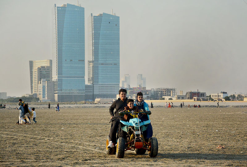 Family enjoying camel ride at Sea view beach Clifton.