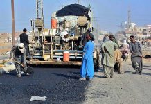 Labourers busy in construction work of Gulistan-e-Sarmast Road during development work in the city