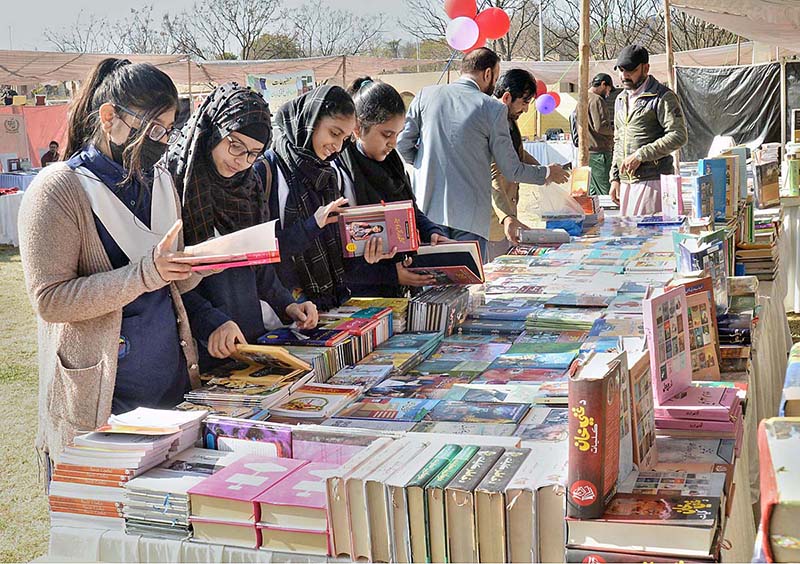 Students are taking keen interest in books at a stall during the 4 days Capital Book Fair-2023 at Arts and Craft Village