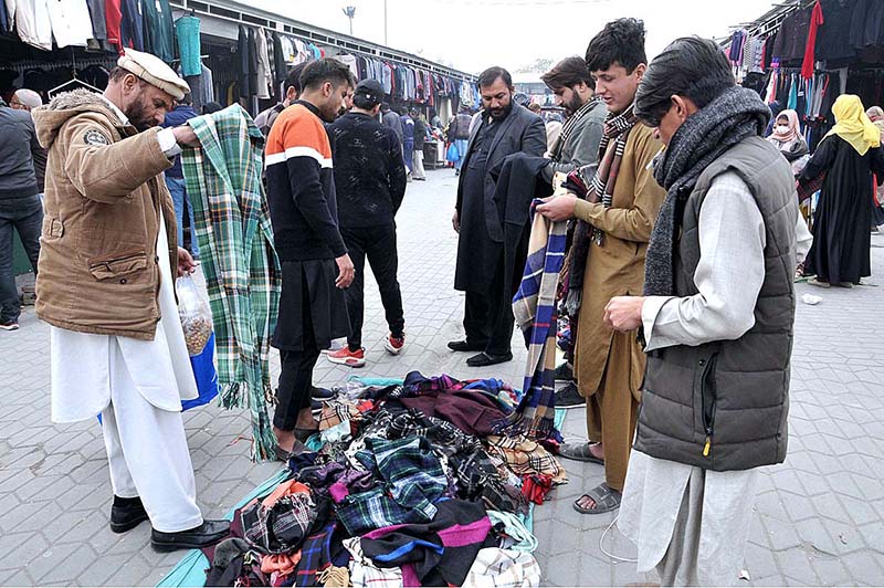 Street vendor selling cotton candy at Weekly Juma Bazar Peshawar Morr