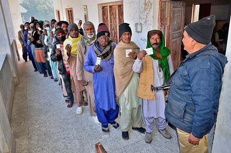 A woman casts her vote in the polling station during Local Government Elections