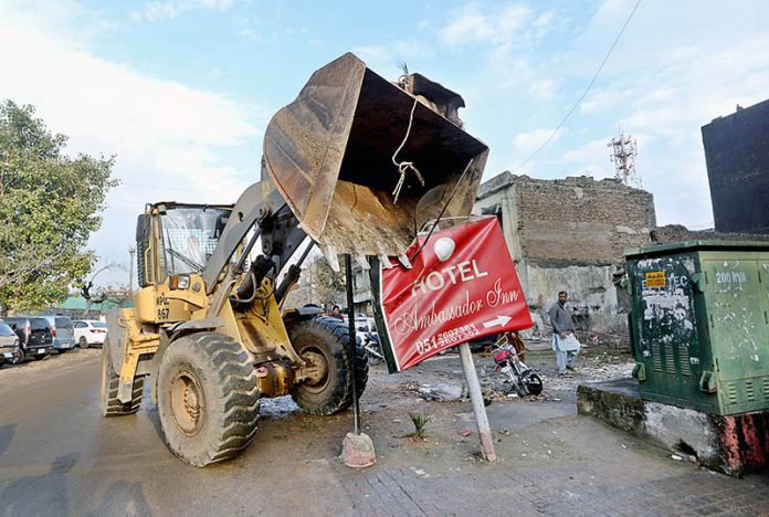 CDA removing encroachments with heavy machinery at Aabpara