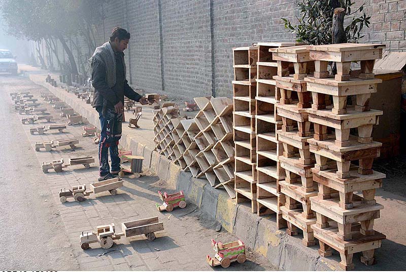 A vendor selling plastic thermos while displaying at roadside