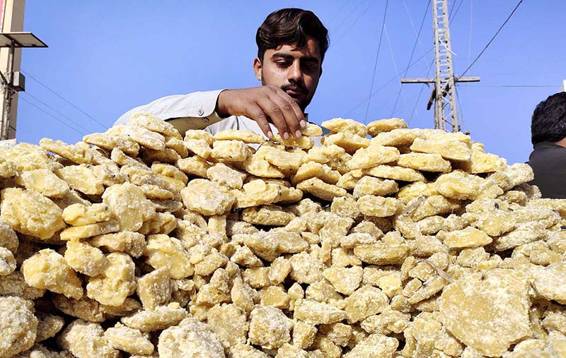 A vendor selling traditional sweetener jiggery (Gurr) at his roadside setup