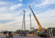 WAPDA workers are installing new electricity pylon at Moti Mahal neighbourhood