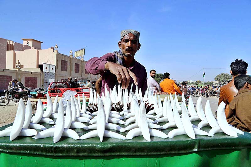 A street vendor displaying coconut on his handcart to attract the customer at jail road in the city