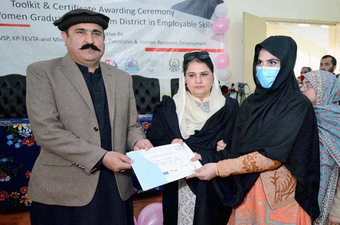 Federal Minister for Overseas Pakistan and Human Resource Development Mr. Sajid Hussain Turi and PPP Senator Rubina Khalid giving certificates to a graduate student during the Toolkit & Certificates Awarding ceremony Among Women Graduates of kurram District in Employable Skill a joint initiative by PGFRC, STVSP, KP-TEVTA and Ministry of Overseas Pakistani & Human Resource Development at GTVC (W) Hayatabad
