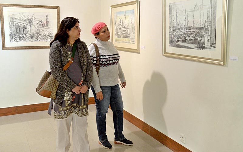 Visitors taking keen interest in painting during the exhibition by Artist Muhammad Javed at Pakistan National Council of the Arts
