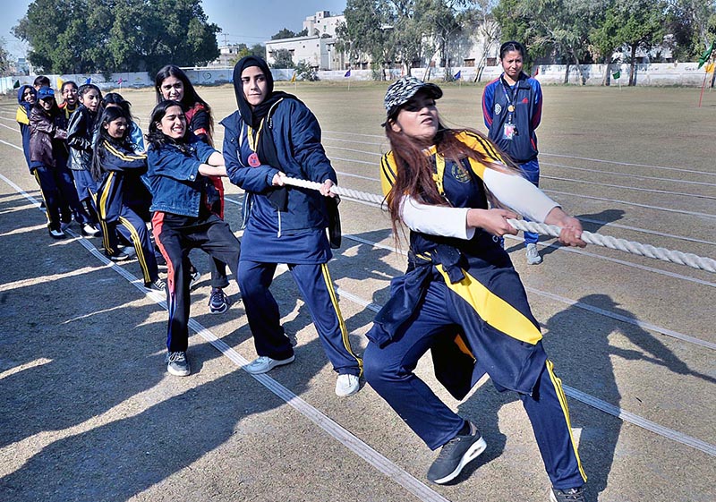 Students in action to pulling rope with full force during tug and war games in county school & collage Sports gala at public school ground