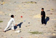Youngsters playing Volleyball game at Rice Canal