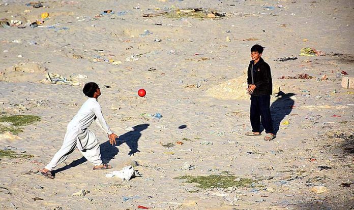 Youngsters playing Volleyball game at Rice Canal