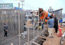 Workers busy in construction work of Bhara Kaho bypass along Sirinagar Highway