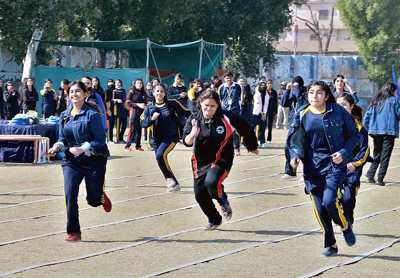 Students in action to pulling rope with full force during tug and war games in county school & collage Sports gala at public school ground