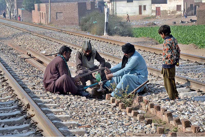 Railway worker repairing Railway line near City Railway Station