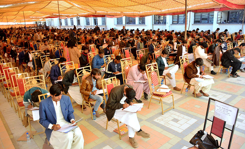 Students solving their question paper during pre-entry test for admission in Sindh Agriculture University Tandojam at Public school