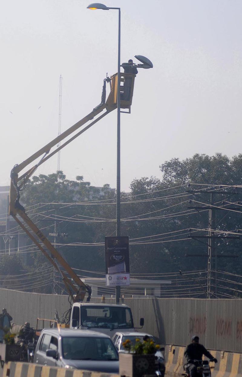 TMA staffer busy in repairing street lights at Katchery road