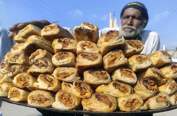 A vendor selling traditional food item near Railway Station
