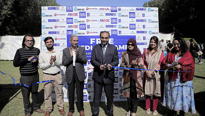 Director Academics Doctor Syed Ali Raza cutting the ribbon to inaugurates free Medical Camp with faculty members at Iqra University North Campus