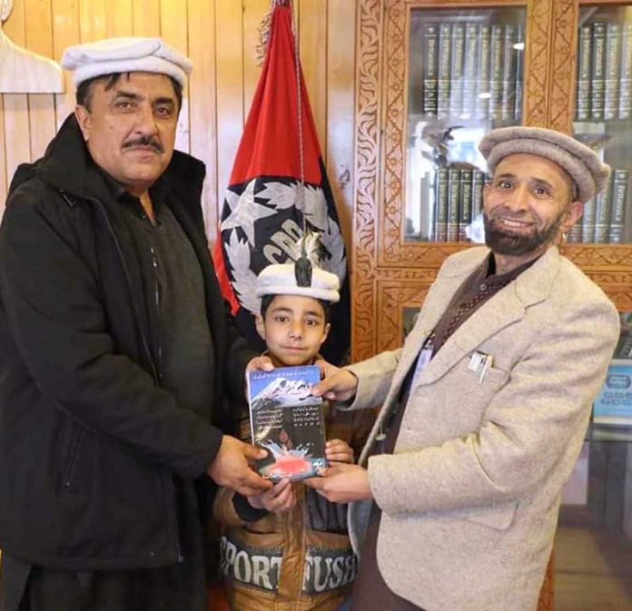Author MA Dilbar Shimali presenting his book 