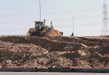 Heavy machinery being used in road construction on Islamabad Expressway