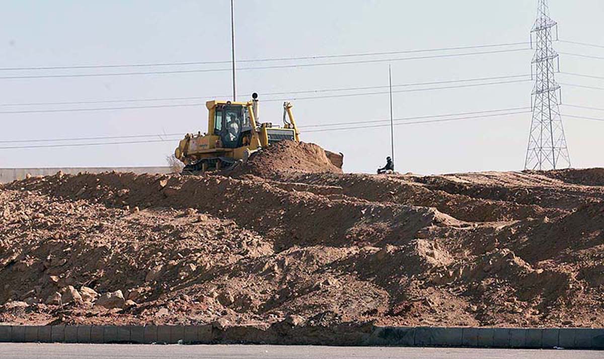 Heavy machinery being used in road construction on Islamabad Expressway