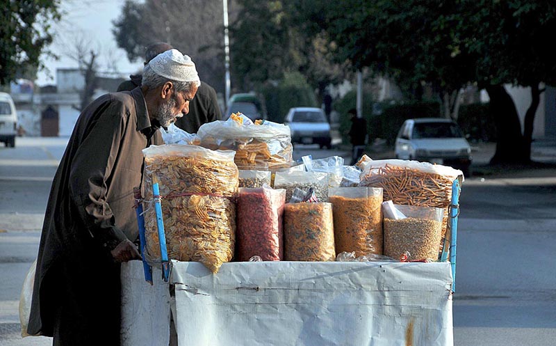 A vendor selling scnaks and dry fruits at sitara market