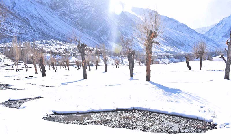 An attractive view of Indus River covered with snow near area of Halmaranga