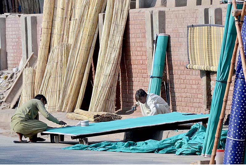 Workers are making traditional curtain (Chik) at their workplace