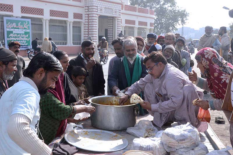 Deserving people standing in a queue to get free food.